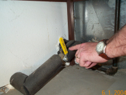 Water Shutoff Example - ball valve on a horizontal pipe coming out from a wall in a garage
