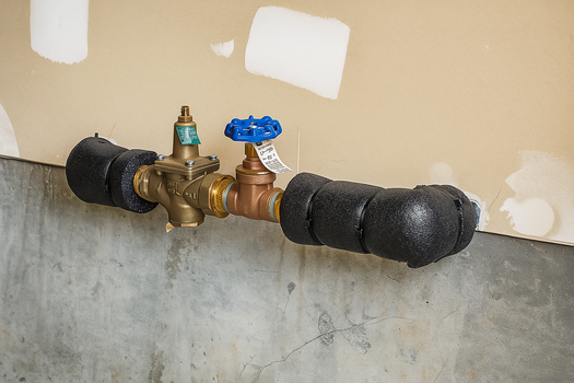 Water Shutoff Example - gate valve on a horizontal pipe coming out from a wall in a garage